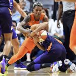 Connecticut Sun guard Courtney Williams, top, wraps up Phoenix Mercury forward DeWanna Bonner in the second half of a WNBA basketball game Friday, July 12, 2019, in Uncasville, Conn. (Sean D. Elliot/The Day via AP)