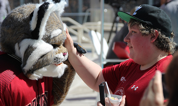 Arizona Diamondbacks mascot D. Baxter the Bobcat interacts with a fan during the unveiling of Abili...