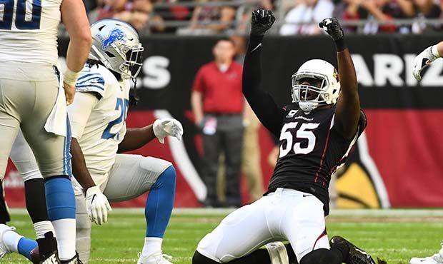 Chandler Jones #55 of the Arizona Cardinals celebrates a tackle against Theo Riddick #25 of the Det...