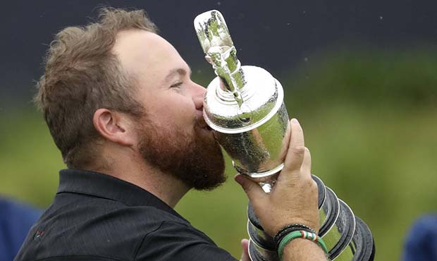 Ireland's Shane Lowry holds and kisses the Claret Jug trophy after winning the British Open Golf Ch...