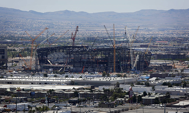 FILE - In this June 4, 2019, file photo, construction cranes surround the football stadium under co...