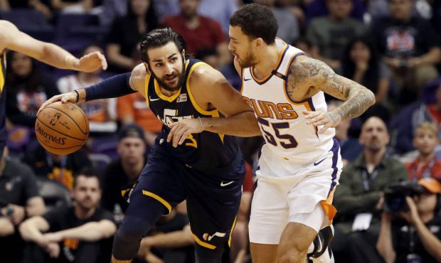 Utah Jazz guard Ricky Rubio (3) pushes the ball up court as Phoenix Suns guard Mike James (55) defe...