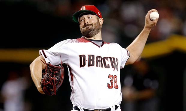 Arizona Diamondbacks pitcher Robbie Ray throws against the Colorado Rockies in the first inning dur...