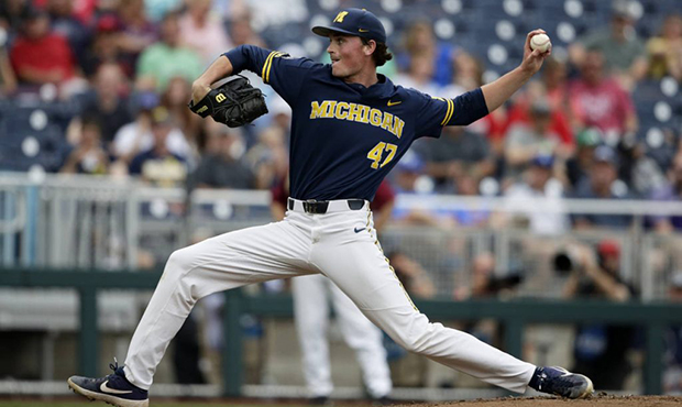 Michigan pitcher Tommy Henry (47) delivers against Florida State in the first inning of an NCAA Col...