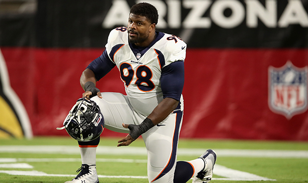 Defensive tackle Clinton McDonald #98 of the Denver Broncos warms up before the preseason NFL game ...