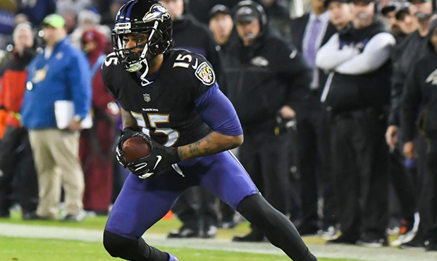 BALTIMORE, MD - DECEMBER 30, 2018: Wide receiver Michael Crabtree #15 of the Baltimore Ravens carri...