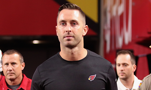 Head coach Kliff Kingsbury of the Arizona Cardinals leads his team onto the field during the NFL pr...