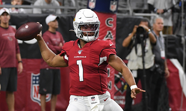 Kyler Murray #1 of the Arizona Cardinals makes a running throw against the Oakland Raiders during a...