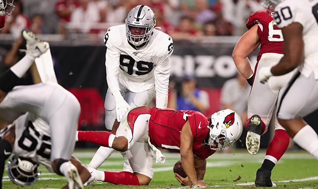 Quarterback Kyler Murray #1 of the Arizona Cardinals is sacked in the end zone for a safety by free...