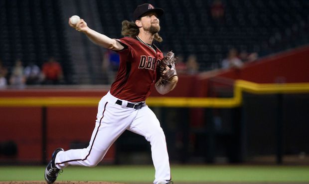 Mike Leake #8 of the Arizona Diamondbacks delivers a pitch in the first inning of the MLB game agai...