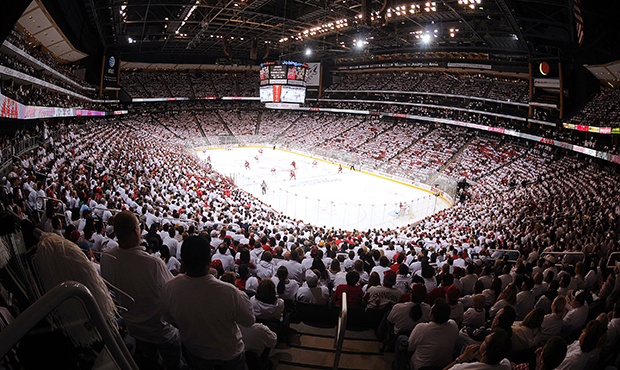 Fans participate in a "WhiteOut" as the Phoenix Coyotes take on the Detroit Red Wings in Game One o...