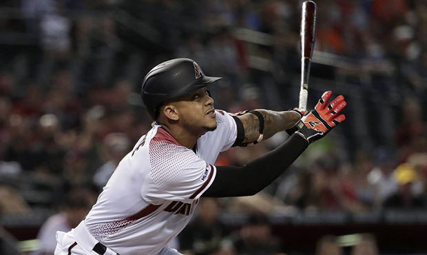 Arizona Diamondbacks' Ketel Marte hits against the Baltimore Orioles during the first inning of a b...