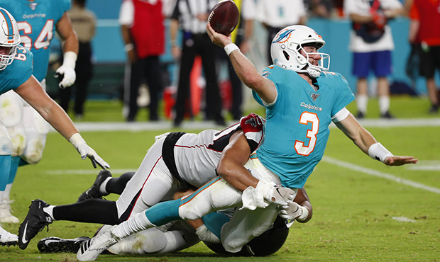 Miami Dolphins quarterback Josh Rosen (3) is tackled by Atlanta Falcons defensive tackle Jacob Tuio...