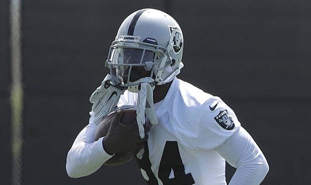Oakland Raiders wide receiver Antonio Brown runs during an official team activity at the NFL footba...