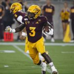 Arizona State running back Eno Benjamin runs with the ball during the first half of the team's NCAA college football game against Kent State on Thursday, Aug. 29, 2019, in Tempe, Ariz. (AP Photo/Ralph Freso)