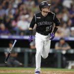 Colorado Rockies' Trevor Story tosses his bat after hitting a solo home run of Arizona Diamondbacks starting pitcher Merrill Kelly in the fourth inning of a baseball game Monday, Aug. 12, 2019, in Denver. (AP Photo/David Zalubowski)