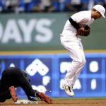 Arizona Diamondbacks' Jarrod Dyson, left, slides safely into second base for a double as Milwaukee Brewers' Cory Spangenberg fields a throw from the outfield during the third inning of a baseball game Saturday, Aug. 24, 2019, in Milwaukee. (AP Photo/Aaron Gash)