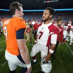 Denver Broncos quarterback Kevin Hogan (9) greets Arizona Cardinals quarterback Brett Hundley after an NFL preseason football game, Thursday, Aug. 29, 2019, in Denver. The Broncos won 20-7. (AP Photo/Jack Dempsey)