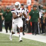 Arizona quarterback Khalil Tate (14) runs down the sideline during the second quarter during of the team's NCAA college football game against Hawaii on Saturday, Aug. 24, 2019, in Honolulu. (AP Photo/Marco Garcia)