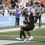 Arizona safety Scottie Young Jr. (6) can't stop Hawaii wide receiver Cedric Byrd II (6) from making a first-quarter touchdown during an NCAA college football game Saturday, Aug. 24, 2019, in Honolulu. (AP Photo/Marco Garcia)