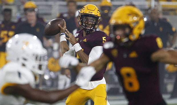 Arizona State quarterback Jayden Daniels looks to pass the ball against Kent State during the first...