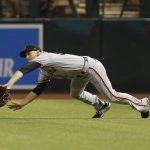 San Francisco Giants right fielder Austin Slater makes a diving catch for an out on a ball hit by Arizona Diamondbacks' Alex Avila in the eighth inning during a baseball game, Saturday, Aug. 17, 2019, in Phoenix. (AP Photo/Rick Scuteri)