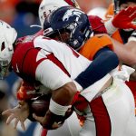 Denver Broncos linebacker Malik Reed sacks Arizona Cardinals quarterback Brett Hundley, left, during the first half of an NFL preseason football game, Thursday, Aug. 29, 2019, in Denver. (AP Photo/David Zalubowski)