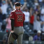 Arizona Diamondbacks relief pitcher Archie Bradley heads to the dugout after giving up a two-run, walkoff home run to Colorado Rockies' Nolan Arenado in the ninth inning of a baseball game Wednesday, Aug. 14, 2019, in Denver. The Rockies won 7-6. (AP Photo/David Zalubowski)