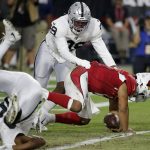 Arizona Cardinals quarterback Kyler Murray (1) is tackled in the end zone for a safety by by Oakland Raiders free safety Lamarcus Joyner, left, as defensive end Arden Key (99) pursues during the first half of an an NFL football game, Thursday, Aug. 15, 2019, in Glendale, Ariz. (AP Photo/Rick Scuteri)