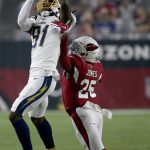 Los Angeles Chargers wide receiver Mike Williams (81) pulls in a catch as Arizona Cardinals defensive back Chris Jones (25) defends during the first half of an NFL preseason football game, Thursday, Aug. 8, 2019, in Glendale, Ariz. (AP Photo/Ross D. Franklin)