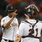 San Francisco Giants pitcher Jandel Gustave celebrates with Stephen Vogt (21) after the Giants defeated the Arizona Diamondbacks 11-6 during a baseball game Saturday, Aug. 17, 2019, in Phoenix. (AP Photo/Rick Scuteri)