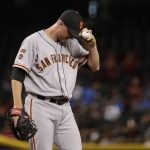 San Francisco Giants' relief pitcher Tony Watson adjusts his cap before leaving the baseball game after giving up two home runs to the Arizona Diamondbacks during the eighth inning Friday, Aug. 16, 2019, in Phoenix. (AP Photo/Matt York)