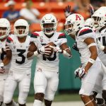 Arizona wide receiver Jamarye Joiner (10) celebrates with teammates after scoring a second-quarter touchdown against Hawaii during an NCAA college football game Saturday, Aug. 24, 2019, in Honolulu. (AP Photo/Marco Garcia)