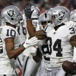 Oakland Raiders running back Mack Brown celebrates his touchdown against the Arizona Cardinals with wide receiver Rico Gafford (10) during the second half of an an NFL preseason football game, Thursday, Aug. 15, 2019, in Glendale, Ariz. (AP Photo/Rick Scuteri)