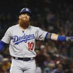 Los Angeles Dodgers' Justin Turner pauses after fouling off an Arizona Diamondbacks pitch during the first inning of a baseball game Thursday, Aug. 29, 2019, in Phoenix. (AP Photo/Ross D. Franklin)