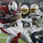 Arizona Cardinals tight end Ricky Seals-Jones (86) makes the catch as Los Angeles Chargers defensive back Adrian Phillips, defensive back Rayshawn Jenkins (23) and defensive back Brandon Facyson (28) defend during the first half of an NFL preseason football game, Thursday, Aug. 8, 2019, in Glendale, Ariz. (AP Photo/Rick Scuteri)