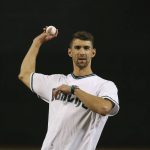 Swimmer Michael Phelps throws out the first pitch prior to a baseball game between the Arizona Diamondbacks and the Los Angeles Dodgers on Thursday, Aug. 29, 2019, in Phoenix. (AP Photo/Ross D. Franklin)