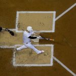 Milwaukee Brewers' Mike Moustakas hits a two-run scoring double during the first inning of a baseball game against the Arizona Diamondbacks Friday, Aug. 23, 2019, in Milwaukee. (AP Photo/Morry Gash)