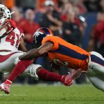 Arizona Cardinals defensive back Nate Brooks (41) is tackled by Denver Broncos wide receiver Brendan Langley (12) after an interception during the first half of an NFL preseason football game, Thursday, Aug. 29, 2019, in Denver. (AP Photo/Jack Dempsey)