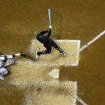 Arizona Diamondbacks' Christian Walker hits a single during the seventh inning of a baseball game against the Milwaukee Brewers Friday, Aug. 23, 2019, in Milwaukee. (AP Photo/Morry Gash)
