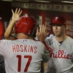 Philadelphia Phillies' Rhys Hoskins (17) celebrates his run scored against the Arizona Diamondbacks with Corey Dickerson, right, during the third inning of a baseball game Monday, Aug. 5, 2019, in Phoenix. (AP Photo/Ross D. Franklin)
