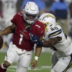 Arizona Cardinals quarterback Kyler Murray (1) tries to elude Los Angeles Chargers linebacker Chris Peace (40) during the first half of an NFL preseason football game, Thursday, Aug. 8, 2019, in Glendale, Ariz. (AP Photo/Ross D. Franklin)