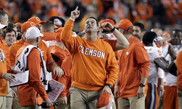 Clemson head coach Dabo Swinney celebrates in the final seconds of the NCAA college football playof...