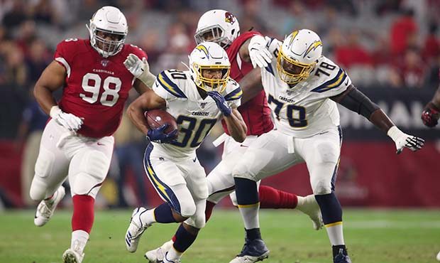 Running back Austin Ekeler #30 of the Los Angeles Chargers rushes the football against the Arizona ...