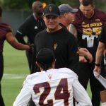 Arizona State assistant head coach Danny Gonzales chats with DB Chase Lucas during the team’s first preseason practice Wednesday, July 31, 2019, in Tempe. (Tyler Drake/Arizona Sports)