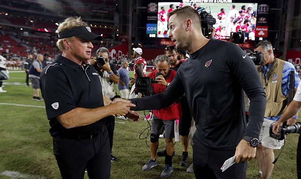 Arizona Cardinals head coach Kliff Kingsbury, right, greets Oakland Raiders head coach Jon Gruden a...