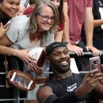 Arizona Cardinals LB Chandler Jones takes a selfie with fans following the team’s Red and White Practice Saturday, August 3, 2019, at State Farm Stadium. (Tyler Drake/Arizona Sports)