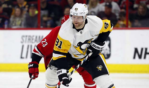 FILE - In this March 19, 2019, file photo, Pittsburgh Penguins' Phil Kessel (81) brings the puck up...