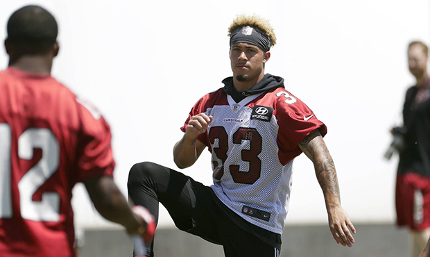 Arizona's Cardinals' Byron Murphy (33) works out during an NFL football organized team activity, We...