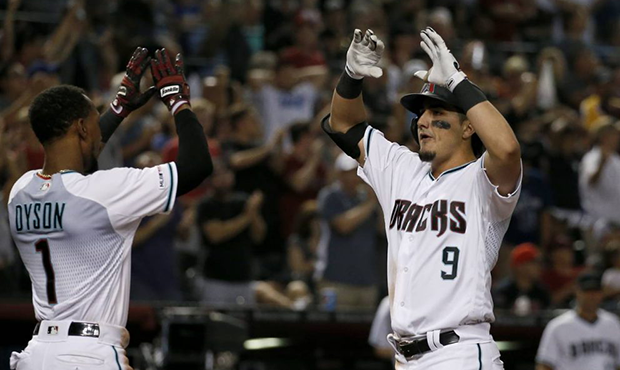 Arizona Diamondbacks' Josh Rojas (9) celebrates his two-run home run against the Los Angeles Dodger...
